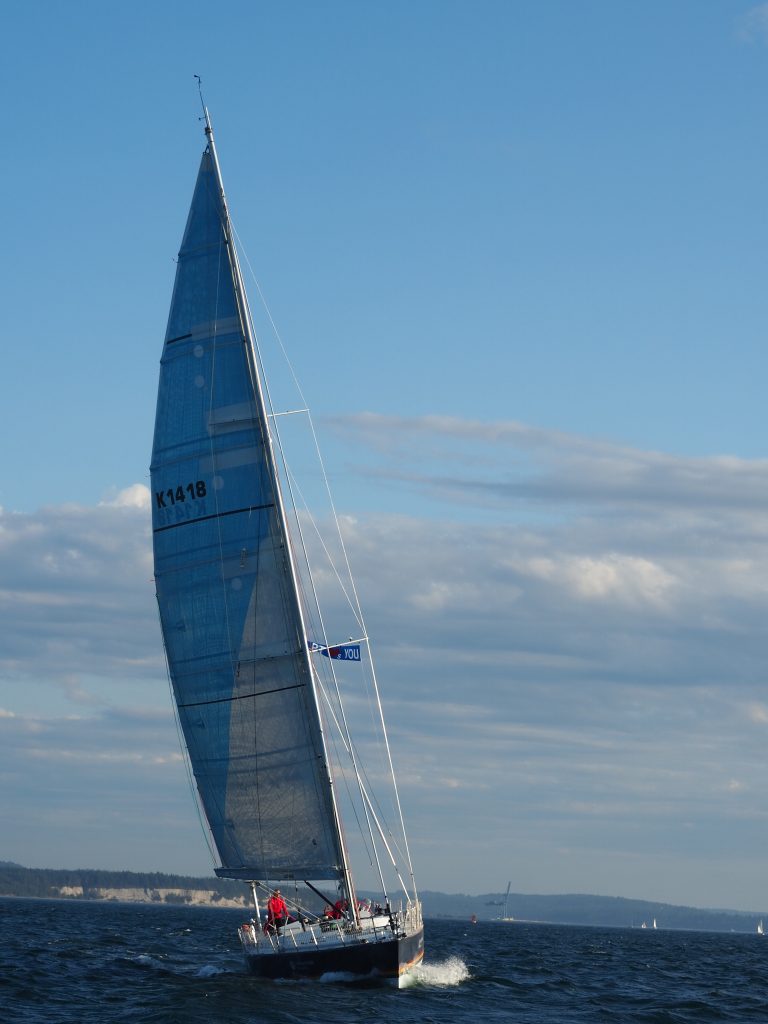 Maiden sailing with a blue sky behind 
