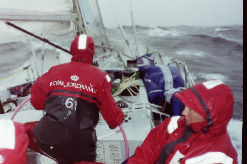 A wet southern ocean - two sailors onboard maiden in full foul weather gear, sodden