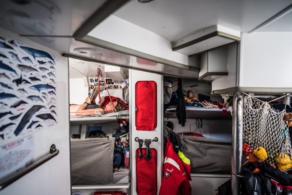 Four bunks onboard Maiden. The bottom two have their sides up, the top two are crew reading.